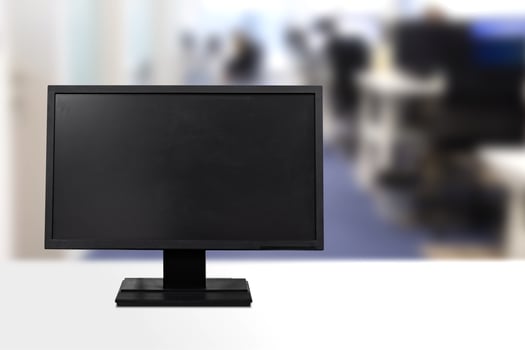 Blank screen desktop computer in office room with copy space photo