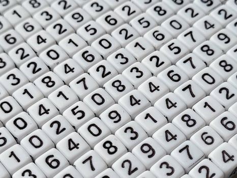 Colorful wooden numbers background. Numbers texture abstraction. Global economy crisis concept. photo