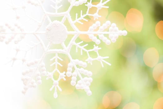 Snowflake Over an Abstract Green and Gold Background photo