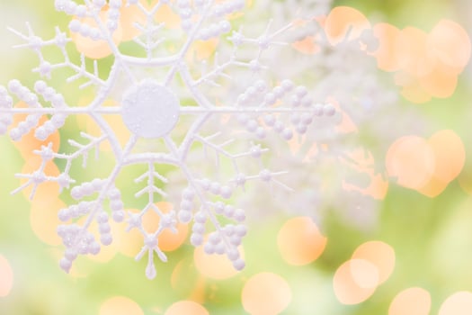 Snowflake Over an Abstract Green and Gold Background photo