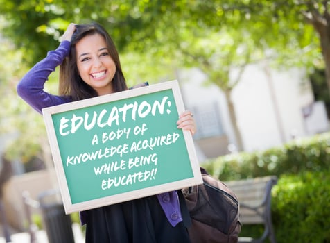 Mixed Race Female Student Holding Chalkboard With Education and Definition photo