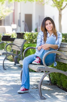 Mixed Race Female Student Portrait on School Campus Bench photo