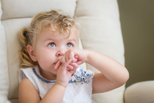 Adorable Blonde Haired and Blue Eyed Little Girl in Chair photo