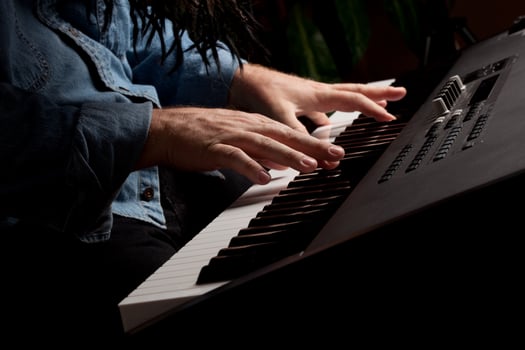 Male Pianist Performs on the Piano Keyboard photo