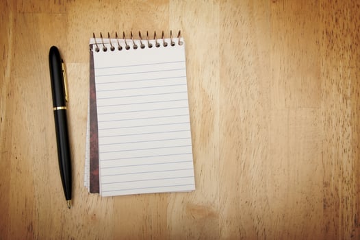 Note Pad and Pen on Wood photo