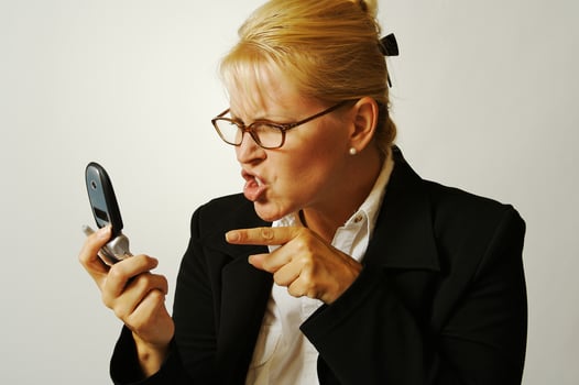 Angry Business Woman on Cell Phone photo