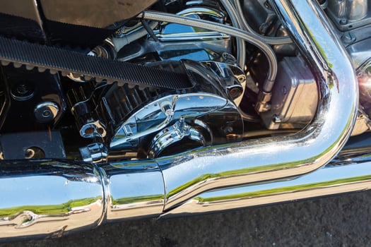 Motorcycle power transmission belt made of kevlar, shiny chrome, exhaust pipe, drive gear, motorcycle tuning photo