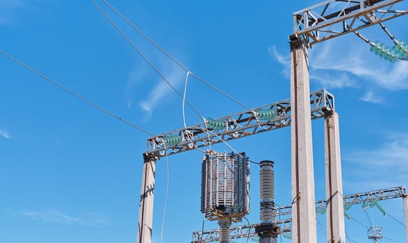 Power lines and switchgear and high voltage equipment in front of the power plant. Safe power supply. Bright sunny day, close-up. photo