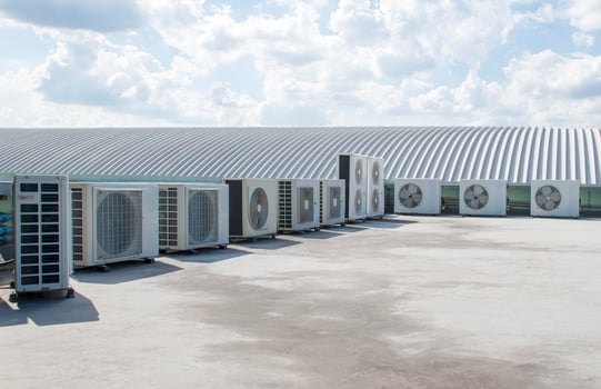 Air compressor on rooftop building photo