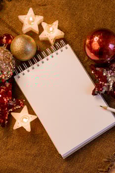 notebook with blank pages with New Year's toys, gifts and numbers 2023. Plans and dreams for the New Year, space for text photo