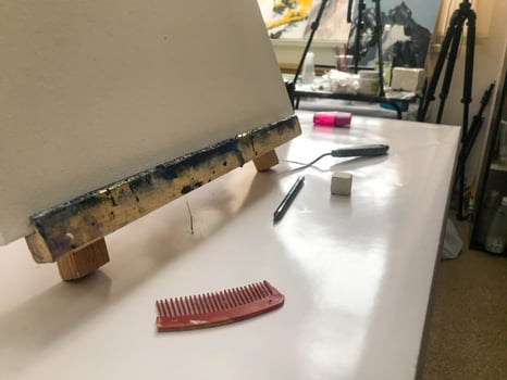 Canvas for drawing and painting with paint and oil in the artist's creative arts workshop with paints and brushes on the table of the art school photo