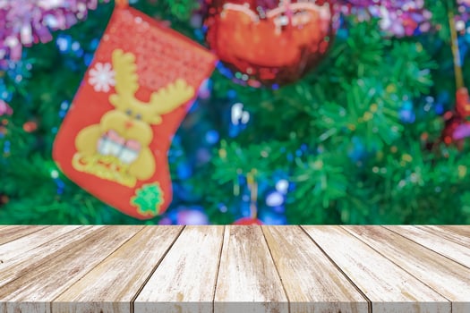 Empty wood table top with blur Christmas tree with bokeh light background photo
