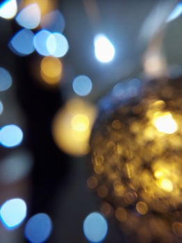 Blurred Christmas garland in the dark and with bokeh lights. Present postcard. New Year's atmosphere. Place for your text. photo