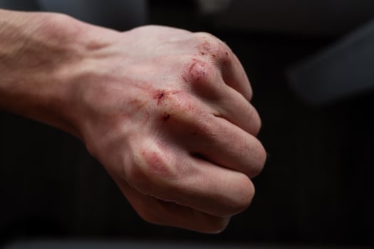 Close-up Of Human Hand Against Gray Background photo