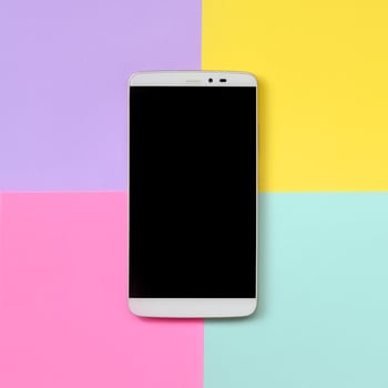Modern smartphone with black screen on texture background of fashion pastel blue, yellow, violet and pink colors paper in minimal concept photo