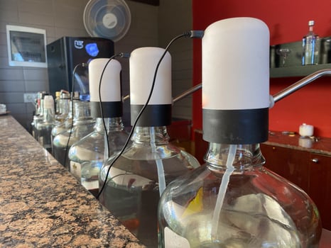 Electronic pump for water on a large bottle with purified drinking water photo