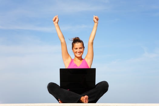 Young happy woman with laptop photo