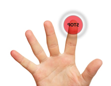 Male hand touching stop button photo