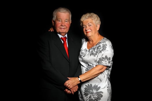 Senior couple on black background photo