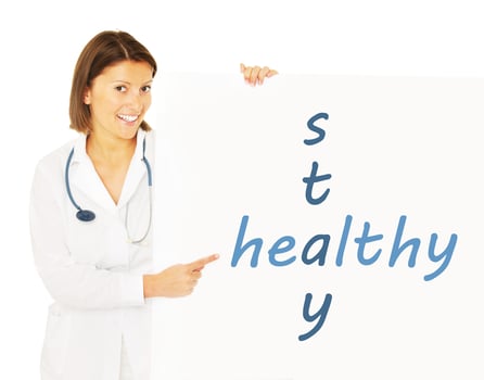 Young female doctor with stethoscope photo