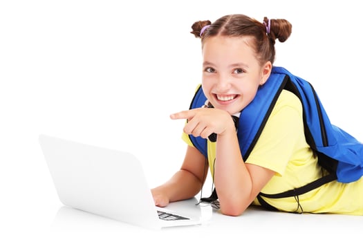 Schoolgirl using laptop photo