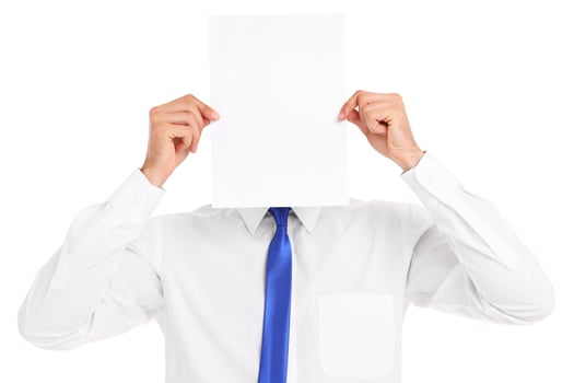 Businessman covering his face with a paper photo