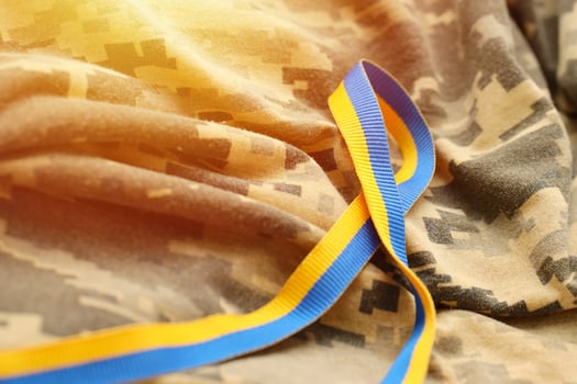 Pixeled digital military camouflage fabric with ribbon photo