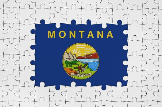 Montana US state flag in frame of white puzzle pieces with missing central part photo