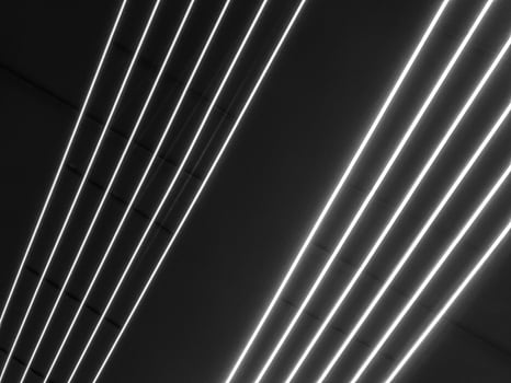 Texture of black and white glowing bright neon LED multicolored laser abstract stripes and lines from parallel lamps. The background photo
