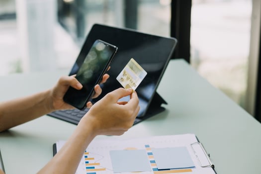 Businessman hand using laptop compter with holding cradit card payments online shopping or business. photo