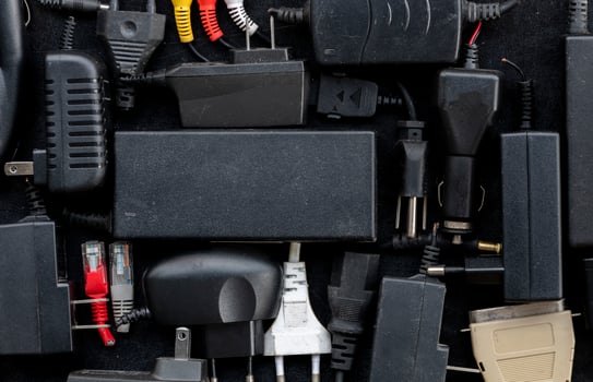 Top view many plug adapter on black floor photo