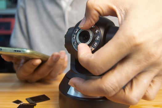 Conceptual man operating ip camera photo