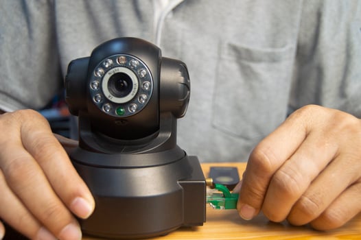 Conceptual man operating ip camera photo