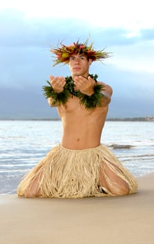 Male Hula Dancer kneels in a Hawaiian pose of worship. photo