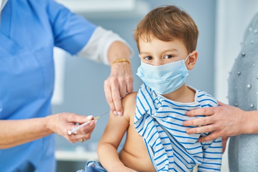 Young kids during vaccination in hospital photo