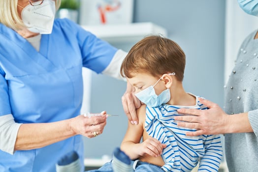 Young kids during vaccination in hospital photo