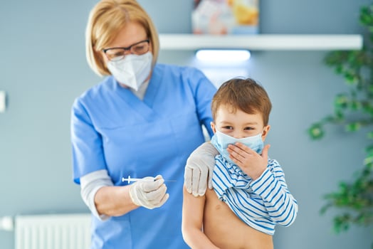 Young kids during vaccination in hospital photo