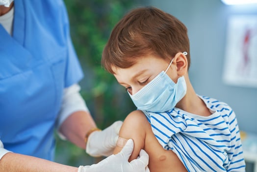 Young kids during vaccination in hospital photo