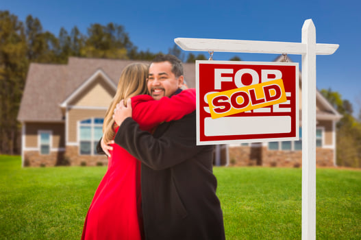 Mixed Race Couple, House, Sold Real Estate Sign photo