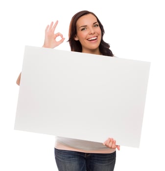 Smiling Mixed Race Female Holding Blank Sign on White photo