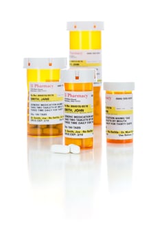Non-Proprietary Medicine Prescription Bottles and Pills Isolated on White photo