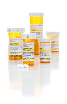 Non-Proprietary Medicine Prescription Bottles and Pills Isolated on White photo