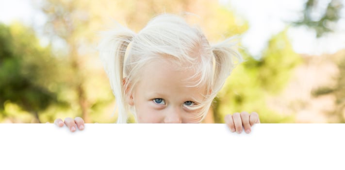 Cute Little Girl Holding White Board with Room For Text photo