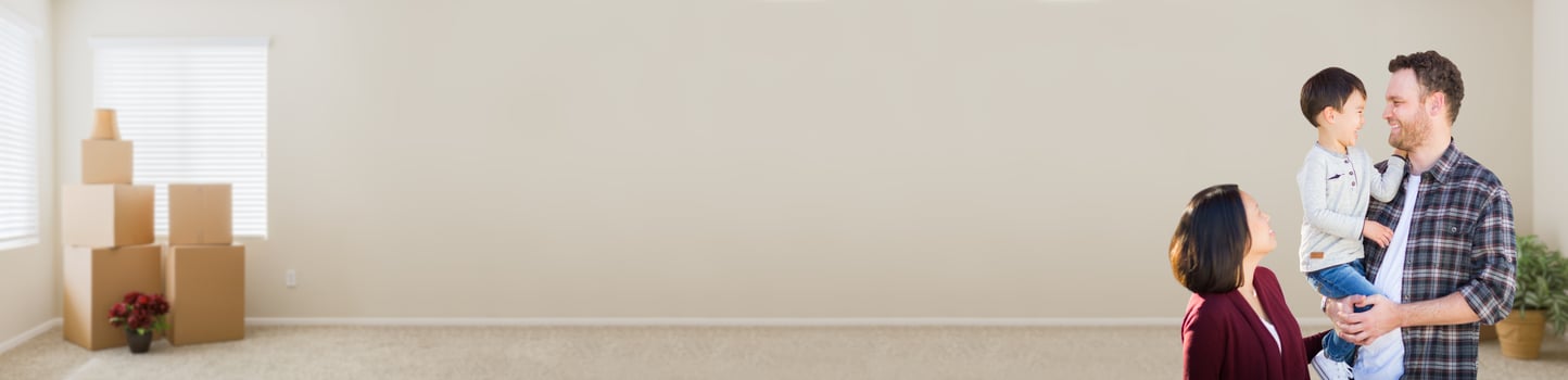 Young Mixed Race Caucasian and Chinese Family Inside Empty Room with Moving Boxes Banner. photo