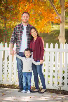 Outdoor Portrait of Mixed Race Chinese and Caucasian Parents and Child. photo