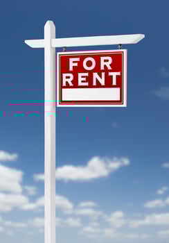 Right Facing For Rent Real Estate Sign on a Blue Sky with Clouds. photo