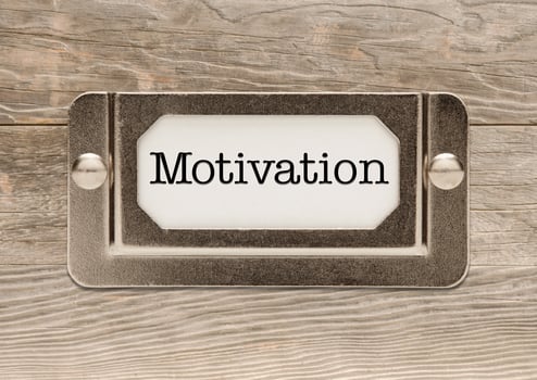 Motivation Metal File Cabinet Label Frame on Wood photo