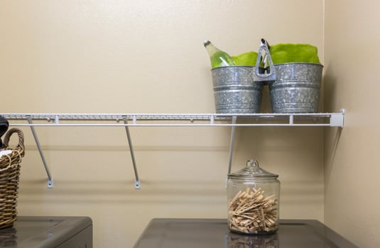 Laundry Room with Buckets and Jar of Clothes Pins photo