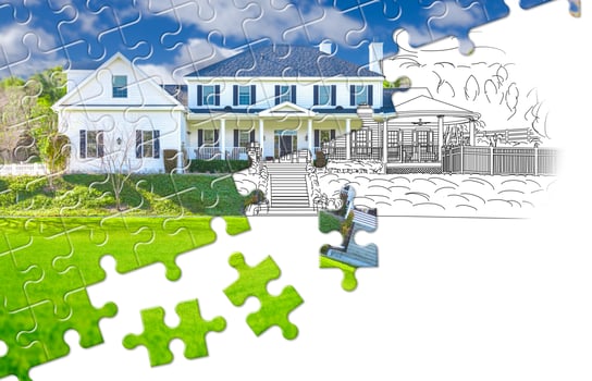 Puzzle Pieces Fitting Together Revealing Finished House Build Over Drawing photo