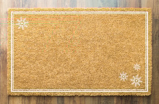 Blank Holiday Welcome Mat With Snow Flakes On Wood Floor Background photo